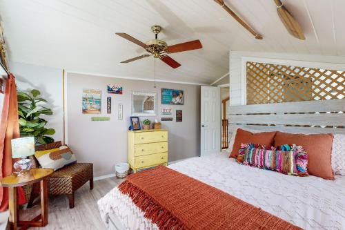 a bedroom with a bed and a ceiling fan at The Blue Laker in Kingsland