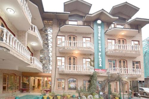 a large building with a sign on the side of it at hotel city plaza in Srinagar