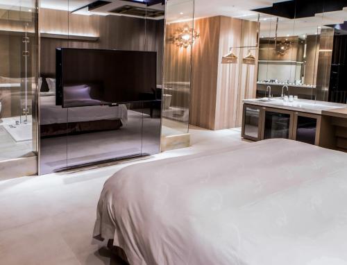 Postel nebo postele na pokoji v ubytování All-Ur Boutique Motel - Xinzhuang Branch