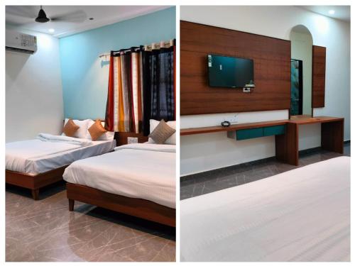 2 Betten in einem Zimmer mit einem TV an der Wand in der Unterkunft hotel heaven in Modāsa