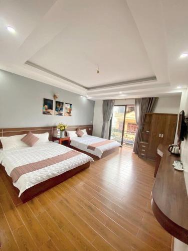 Кровать или кровати в номере PHÚC HƯNG HOTEL