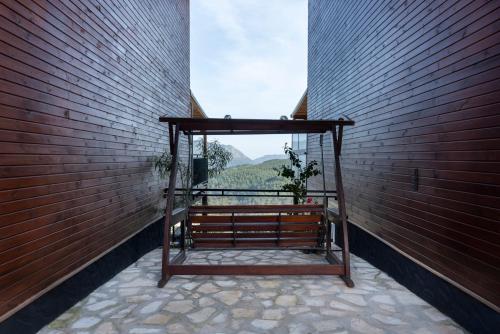 a balcony with a bench in a brick wall at La Veranda Villas in Kumluca