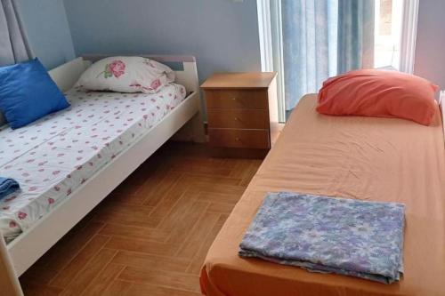 Säng eller sängar i ett rum på πολυτελής εξοχική κατοικία