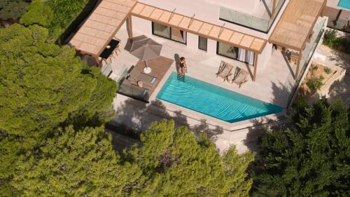 an overhead view of a house with a swimming pool at Irida Hotel Agia Pelagia in Agia Pelagia