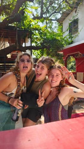 a group of women are posing for a picture at Mitra Hostel in Arambol
