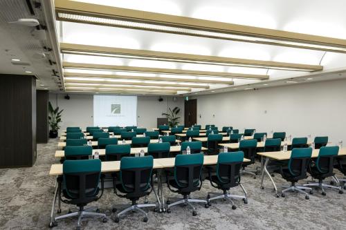 a conference room with a table and chairs in it at Chisun Hotel Hamamatsucho in Tokyo