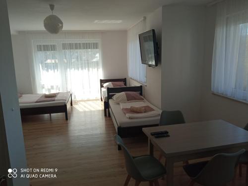 מיטה או מיטות בחדר ב-Bożenka