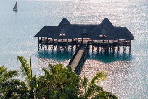 an aerial view of a resort in the water at Delta Hotels by Marriott Dar es Salaam in Dar es Salaam