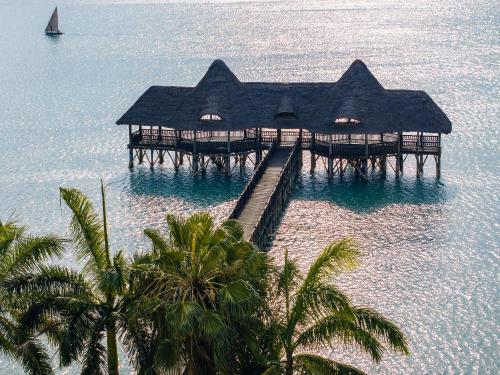 an aerial view of a resort in the water at Delta Hotels by Marriott Dar es Salaam in Dar es Salaam
