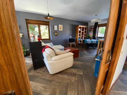 a living room with a white couch and a table at Apartamento en El Boalo in Boalo