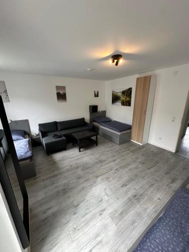 a living room with a couch and a table at Schöne Apartments in Königsdorf BM01 bis BM04 in Frechen