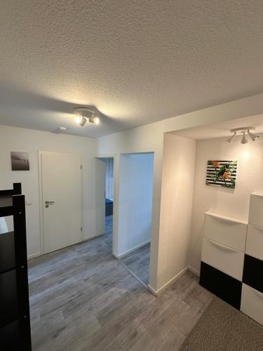 an empty room with a door and a mirror at Schöne Apartments in Königsdorf BM01 bis BM04 in Frechen