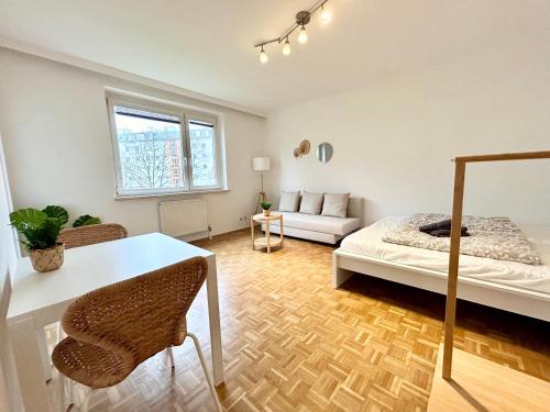 a living room with a bed and a couch at StayRoom Apartments I "Woody5" neben Donaulände in Linz