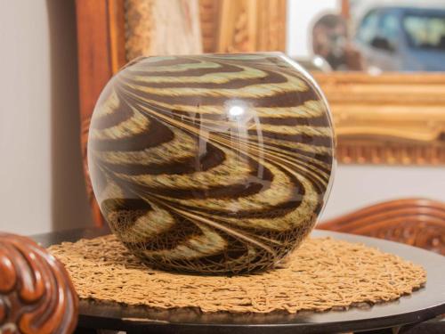 a vase sitting on top of a table at River-Ridge Guest House in Gaborone
