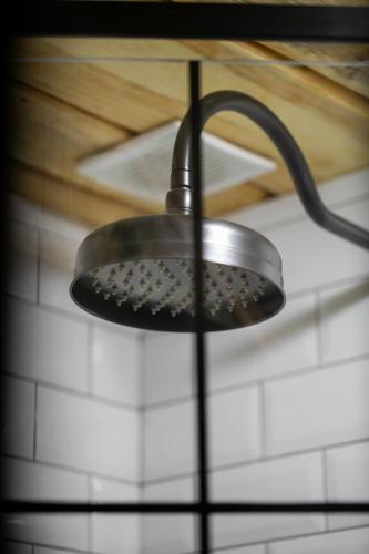 a metal light hanging from the ceiling of a kitchen at Ранчо Скарбова Гора in Selisko