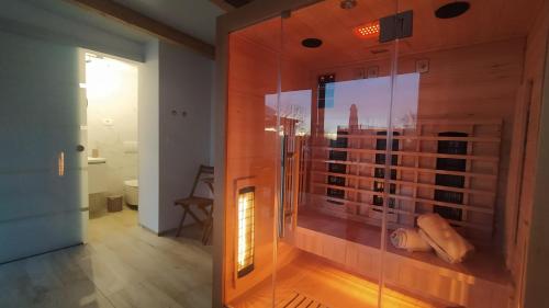 a glass shower in a room with a view of the city at Villa Molo in Novigrad Istria