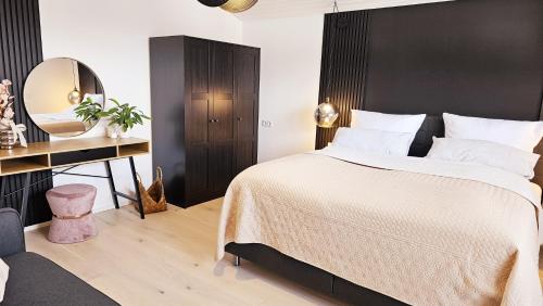 Ferienwohnungen Krüger 'Apartment Moni'にあるベッド