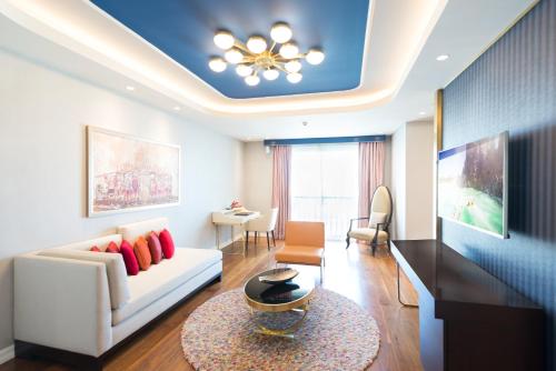 a living room with a couch and a table at The Land Of Legends Kingdom Hotel - All-in Concept in Belek