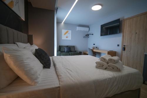 Ένα ή περισσότερα κρεβάτια σε δωμάτιο στο Smart green appartments ΕE