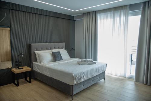 Ένα ή περισσότερα κρεβάτια σε δωμάτιο στο Smart green appartments ΕE