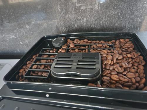 a tray of coffee beans sitting on a stove at City Sense - Apartament z widokiem na góry i miasto in Bielawa