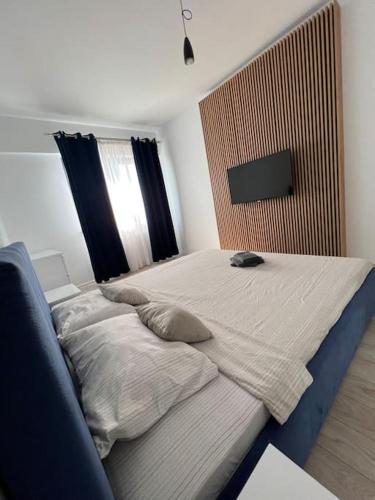 Ένα ή περισσότερα κρεβάτια σε δωμάτιο στο Lake View Aparthotel