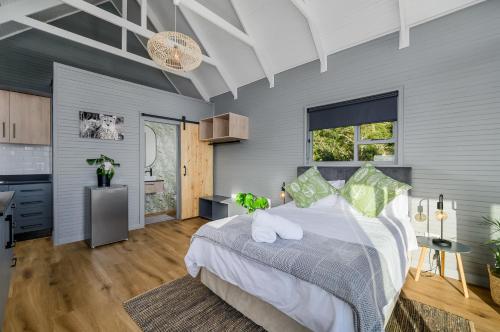 a bedroom with a large bed in a room at Kragga Kamma Game Park in Port Elizabeth