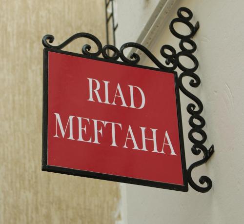 a sign on a building at Riad Meftaha in Rabat