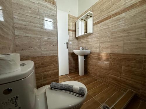 a bathroom with a toilet and a sink at Skiathos Hills Studios in Skiathos