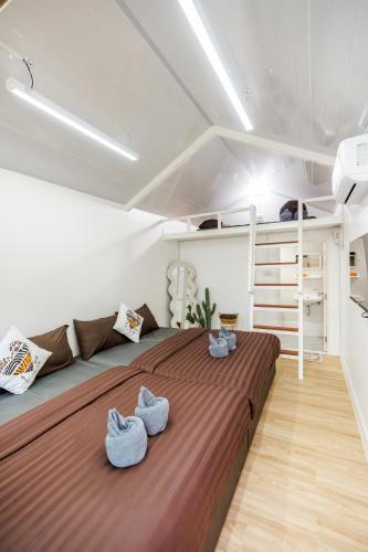 a bedroom with a large bed in a room at BoHome Pool Villa Cha-am in Ban Sa