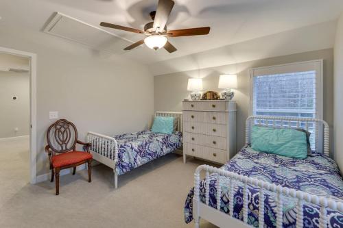a bedroom with two beds and a ceiling fan at Beautiful cottage next to Tims Ford Lake in Tullahoma