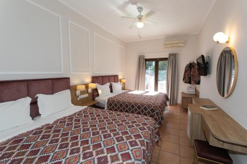 Postel nebo postele na pokoji v ubytování Paradise Hotel