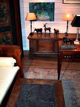 a room with a table with figurines of animals on it at BnB Atelier de St. Maurice in Vésenaz