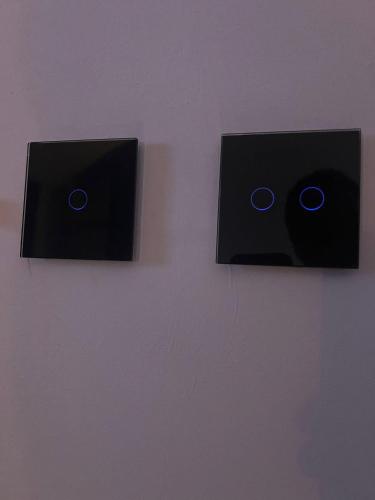 two black speakers are attached to a wall at NOVA LUXURY DESIGN in Zagreb