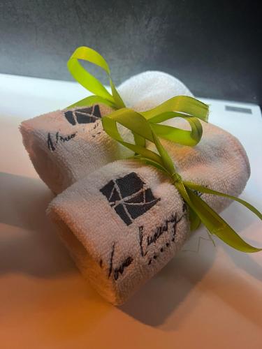 a sock with a green plant on top of it at NOVA LUXURY DESIGN in Zagreb
