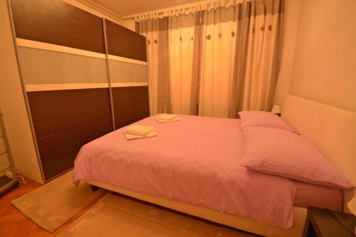 Postel nebo postele na pokoji v ubytování Sole Mio Apartment