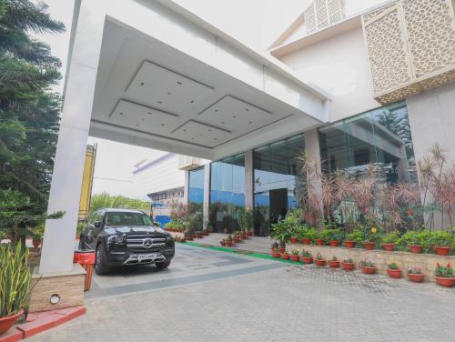 a car parked in front of a building at The Greenwood, Tezpur in Tezpur