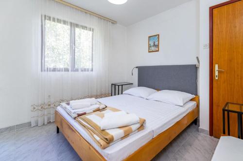 Posteľ alebo postele v izbe v ubytovaní Apartments Janko Zarok