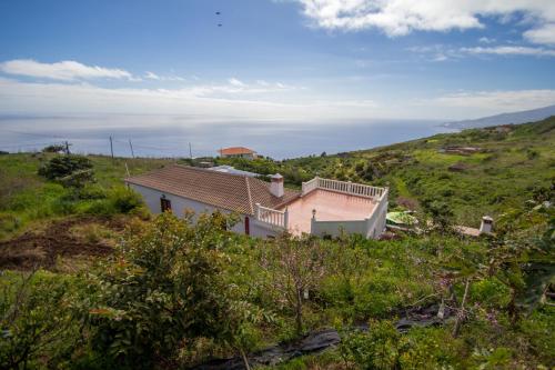 a house on the side of a hill at Juanita in Puntallana