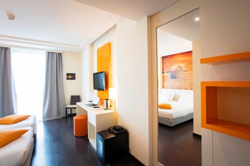 Postel nebo postele na pokoji v ubytování AN Hotel Milano Melegnano
