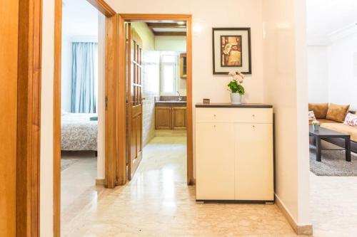 a hallway with a living room and a bedroom at Bel appartement au centre de Casa in Casablanca