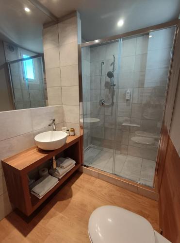 a bathroom with a shower and a sink and a toilet at Hotel Concord - Nel cuore di Riccione in Riccione