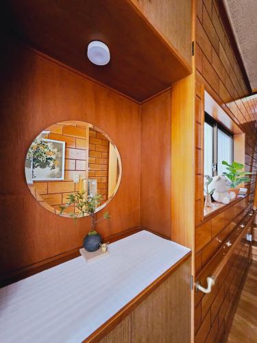 a small room with a counter with a mirror at AsahiStay -Koiwa, Free parking O, Whole Family House, Japanese garden taste in Tokyo