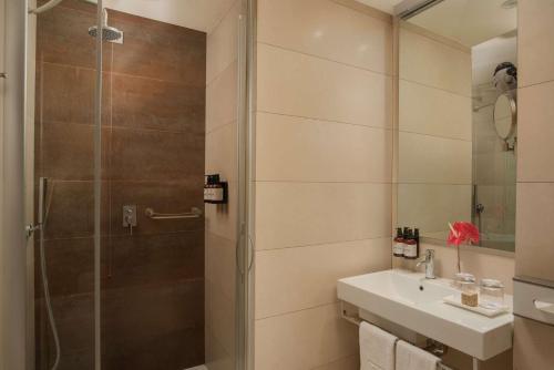 a bathroom with a shower and a sink at NH Orio Al Serio in Orio al Serio