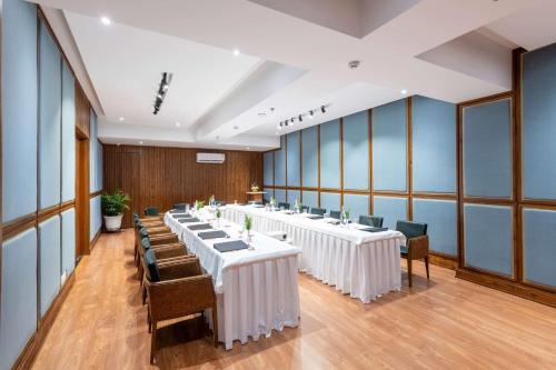 a row of tables and chairs in a room at Ramada by Wyndham Kasauli in Kasauli