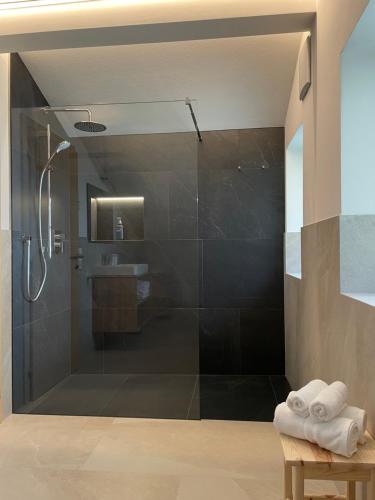 a bathroom with a shower and a sink at Ferienhaus Gann - Greit in Villandro