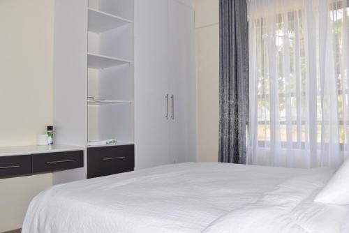 Ένα ή περισσότερα κρεβάτια σε δωμάτιο στο Viwak Homes