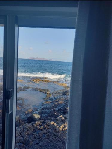 a view of the ocean from a window at L2B - São Vicente in Mindelo