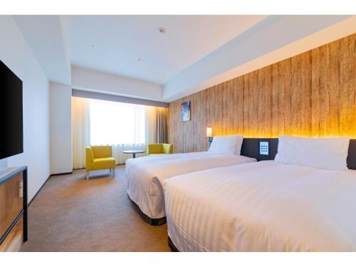 Postel nebo postele na pokoji v ubytování LIBER HOTEL Osaka