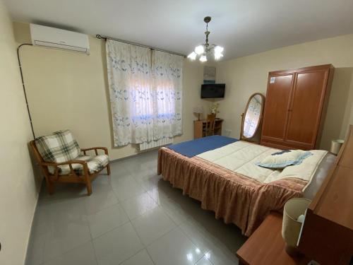 En eller flere senger på et rom på Villa Caniles